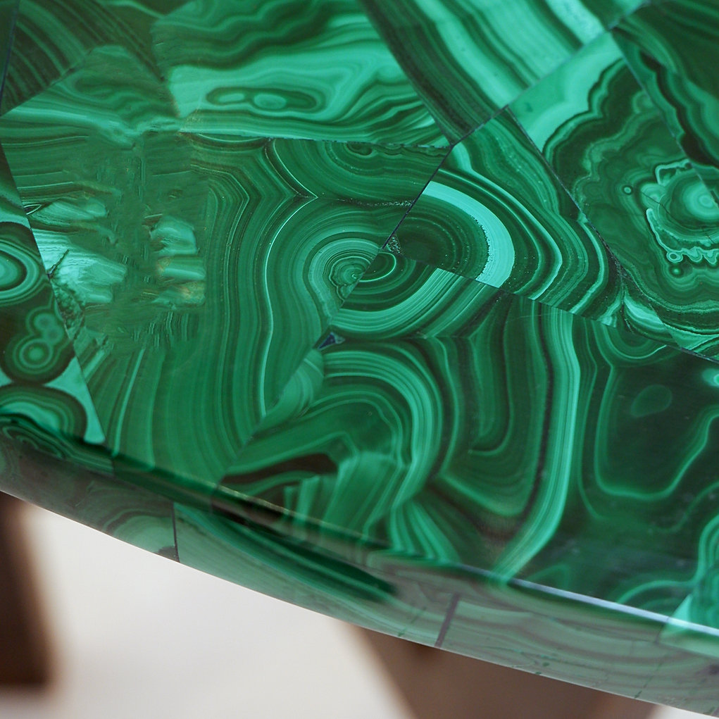 Console table with malachite top on double tripod base in black metal