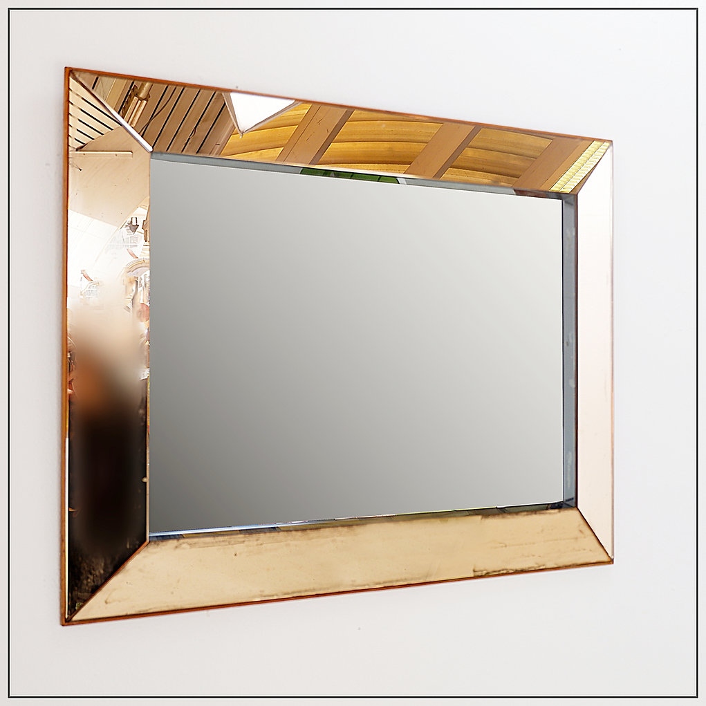 Mid-century modern mirror in the style of Jacques Adnet