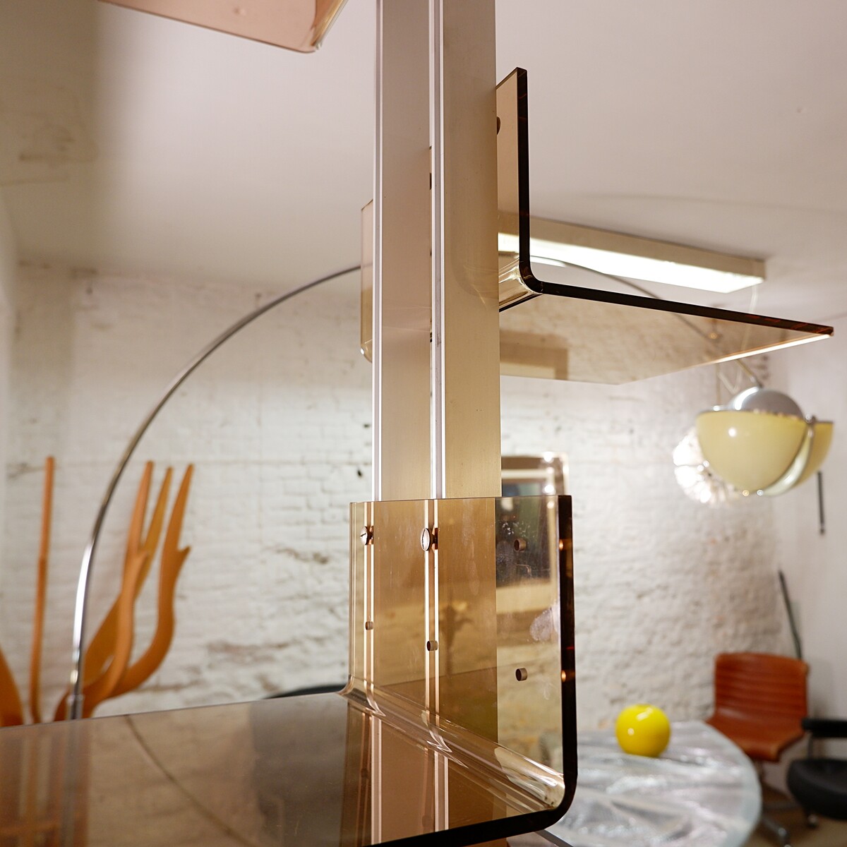 modular floor/ceiling shelf in brushed metal and acrylic in the spirit of Michel Ducaroy