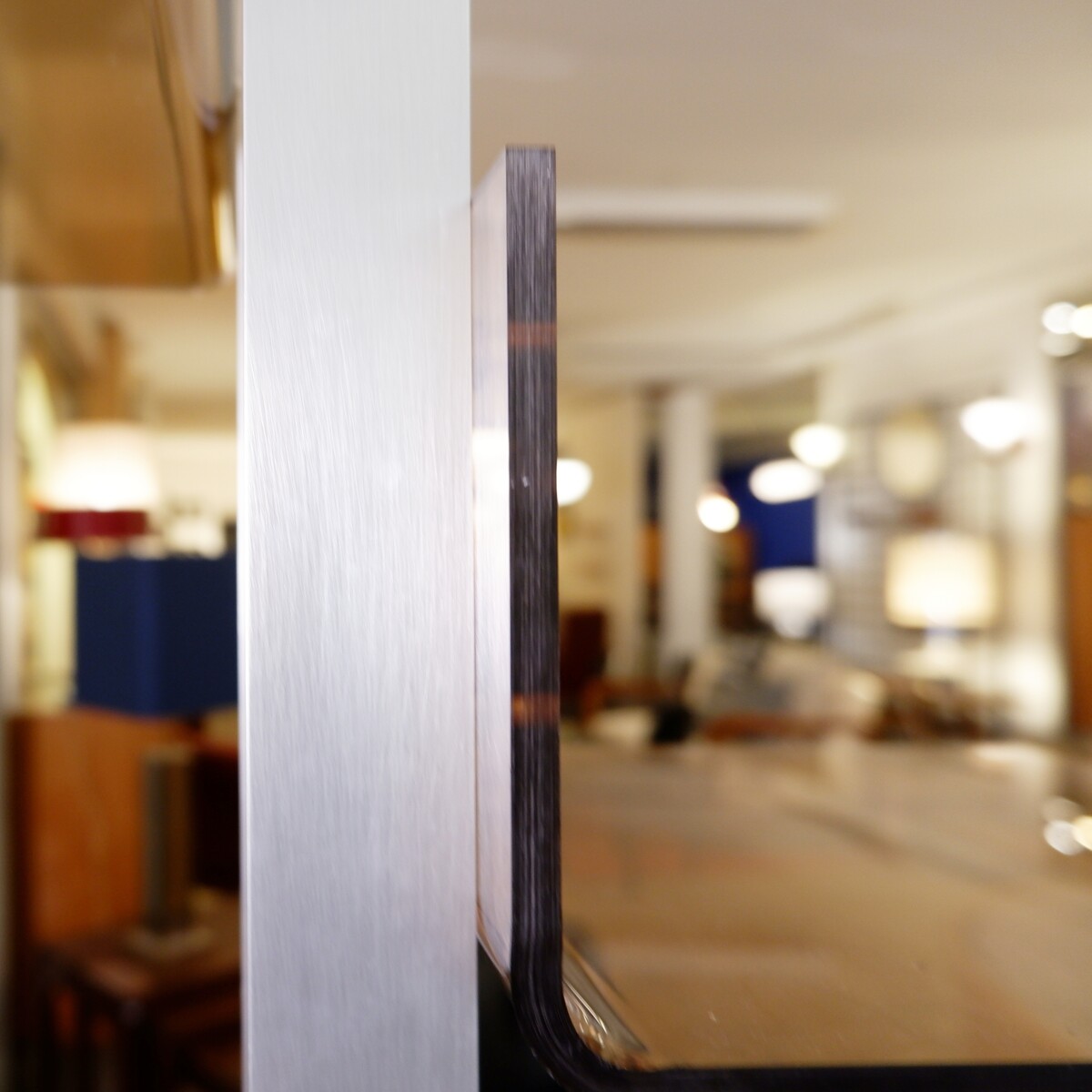 modular floor/ceiling shelf in brushed metal and acrylic in the spirit of Michel Ducaroy