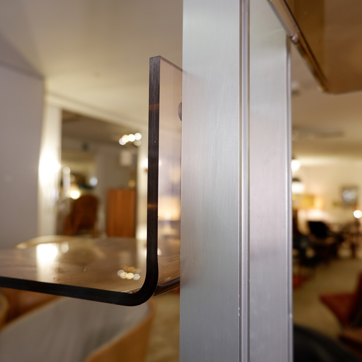 modular floor/ceiling shelf in brushed metal and acrylic in the spirit of Michel Ducaroy